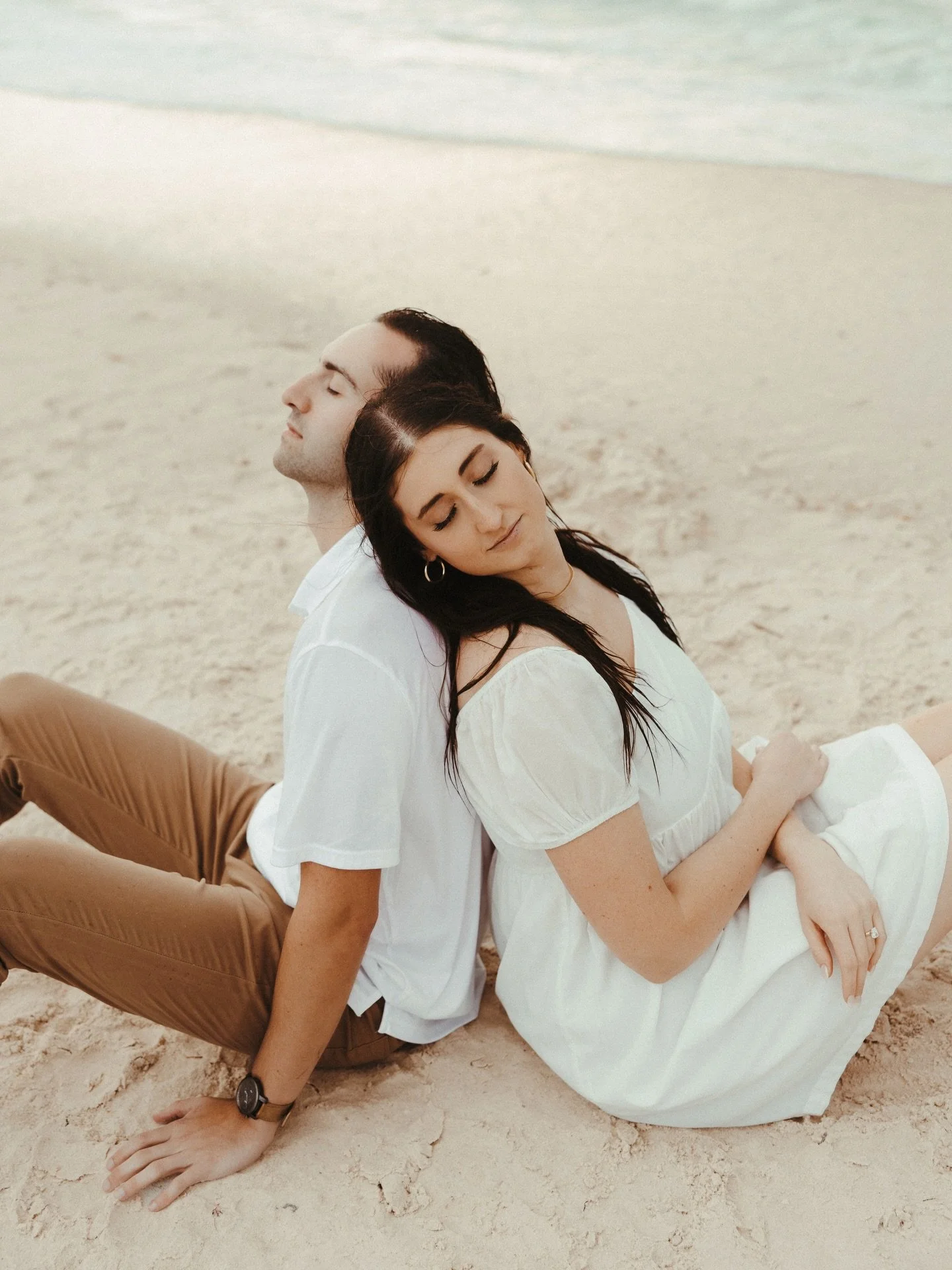 I think I may be cursed with rain during any beach session. Especially if it involves couples in love trying to document the next step in their lives. These two braved the rain and honestly I think I loved the photos even more. Congratulations @teaga