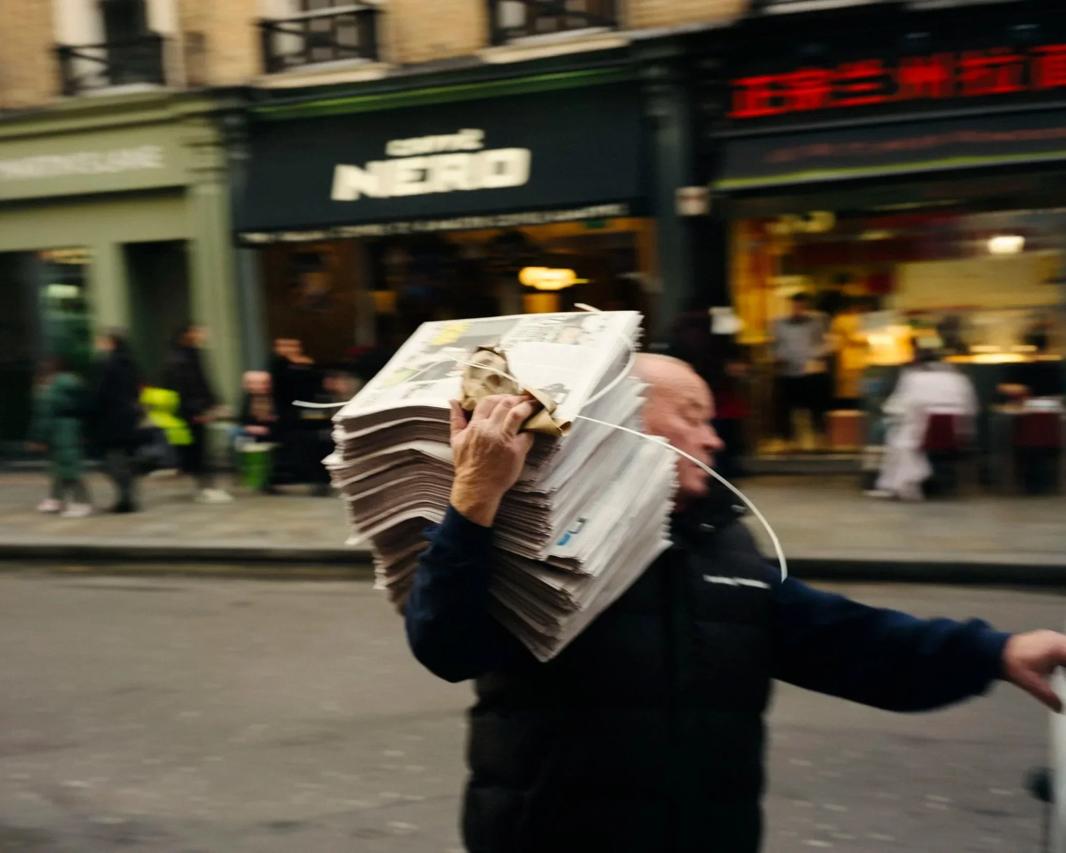 LondonSoho_ManAndNewsPapers.webp