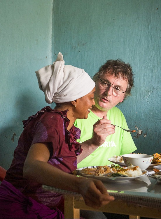 Andoni speaking with mama zai eating.jpg