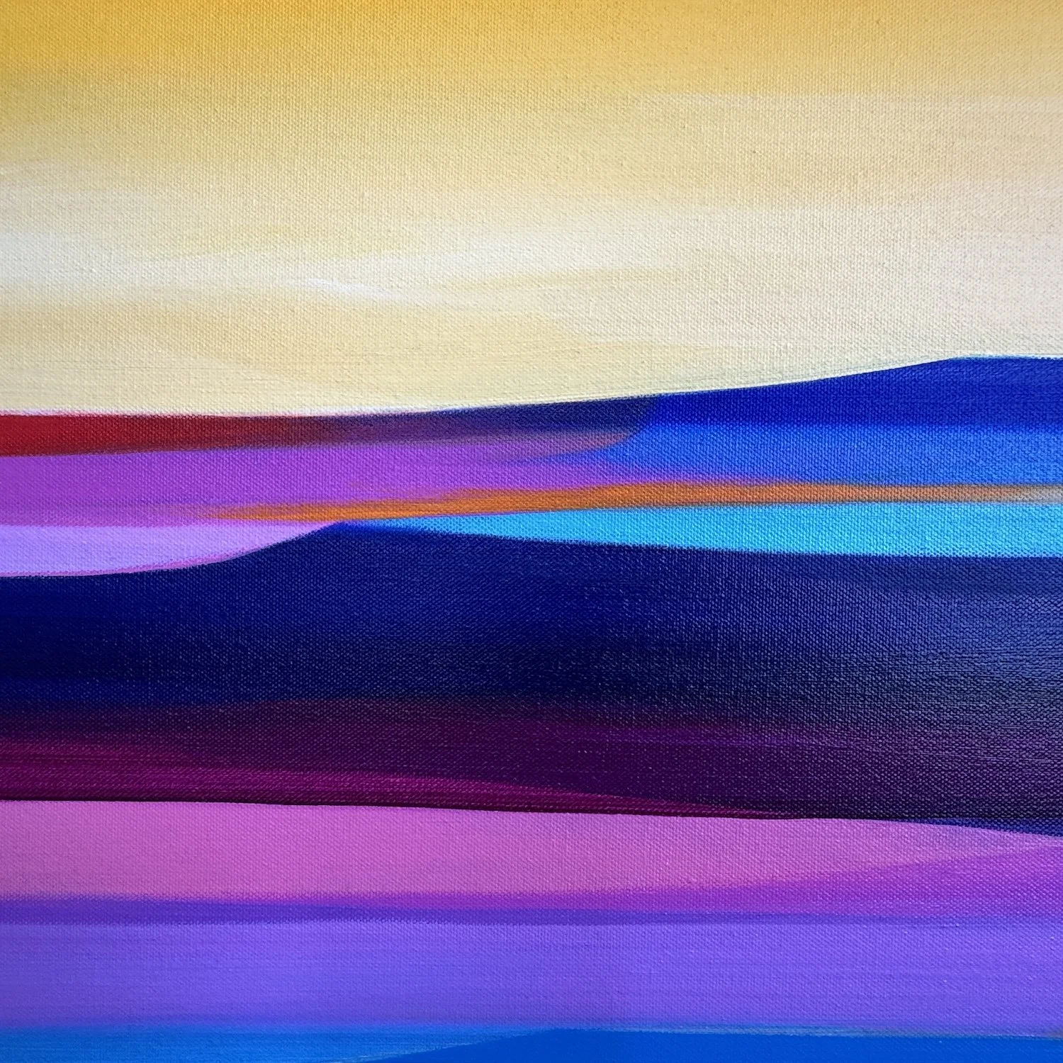 Abstract hills beneath a warm sunset sky