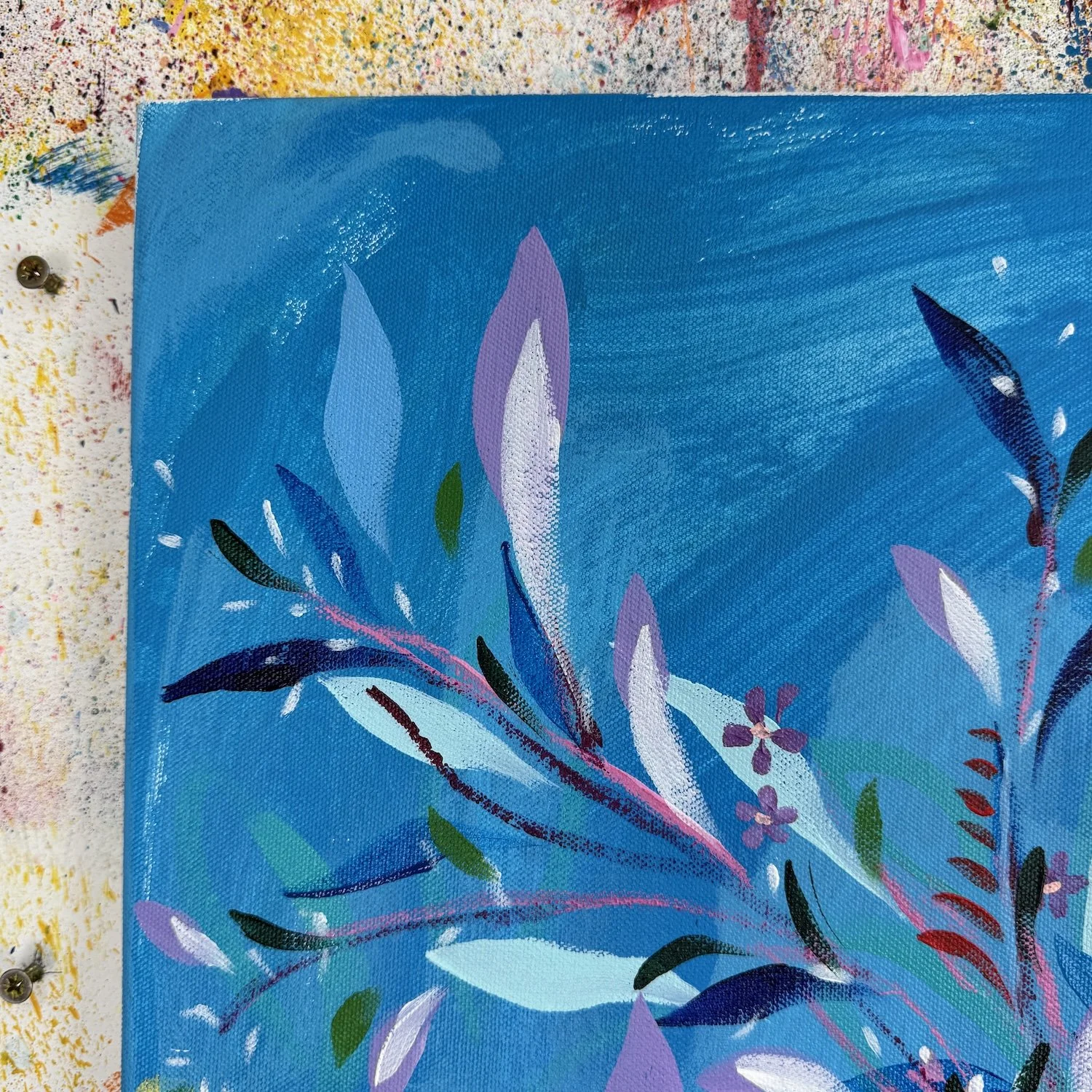 Bold floral painting with vibrant tones and deep blue background
