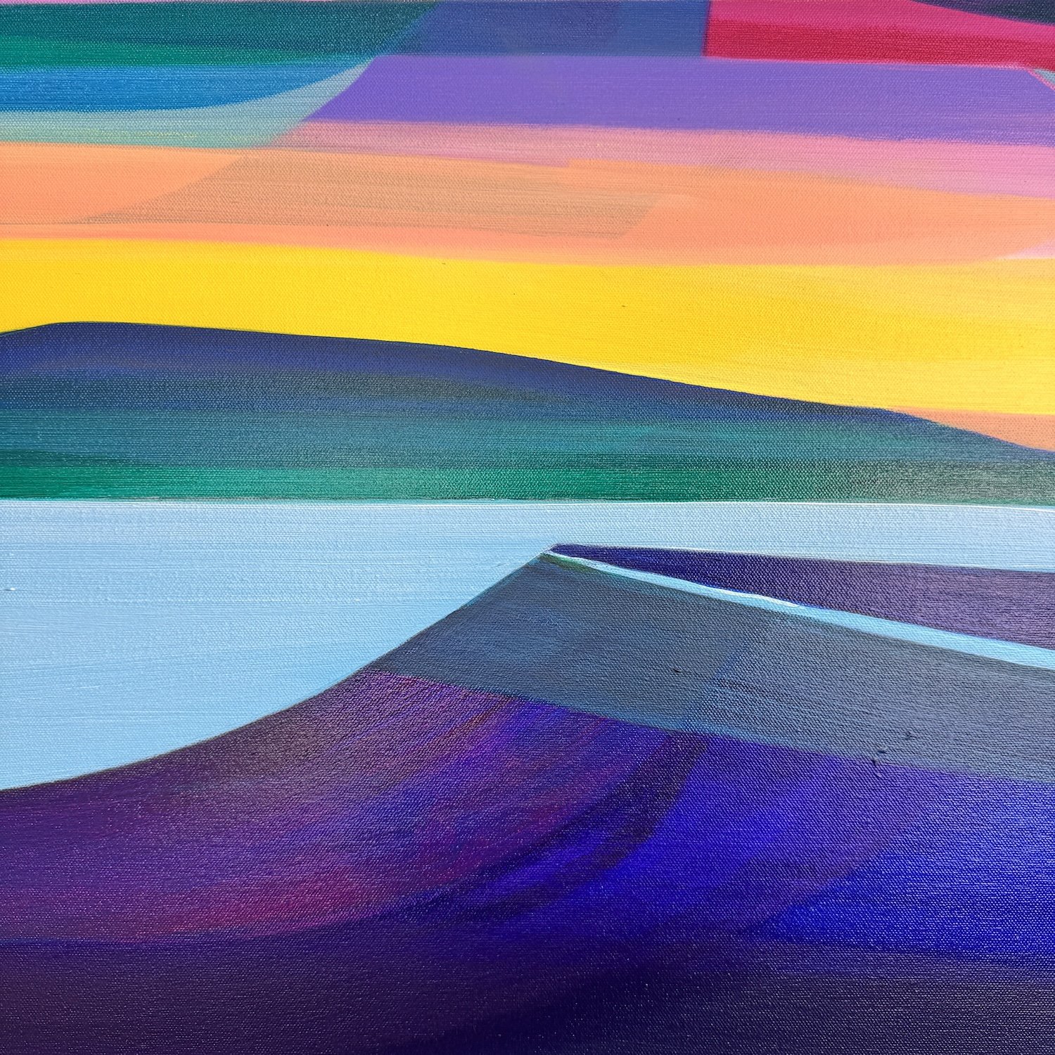 Abstract hills beneath a soft sunset sky in pink and yellow