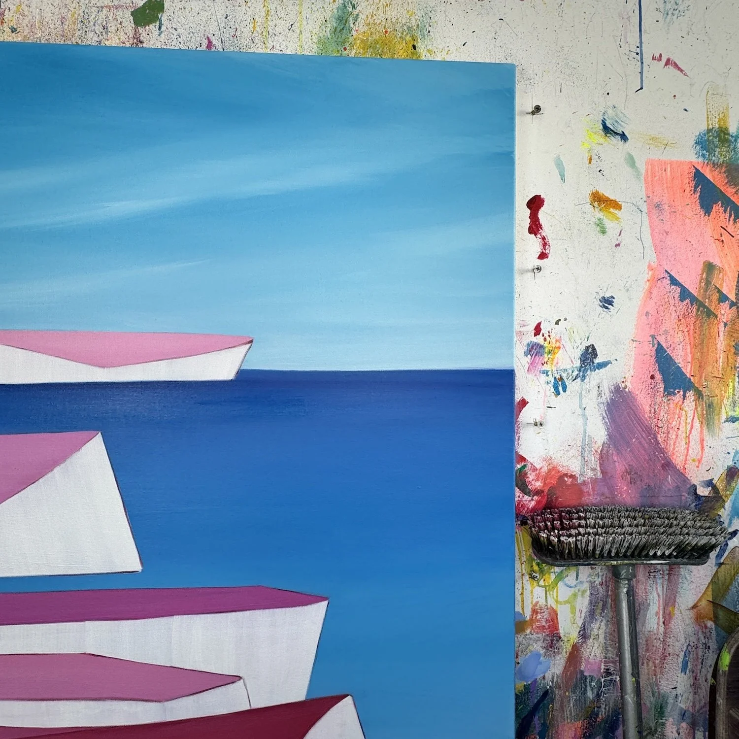 Close-up of textured paint in pink cliffs and blue sea artwork