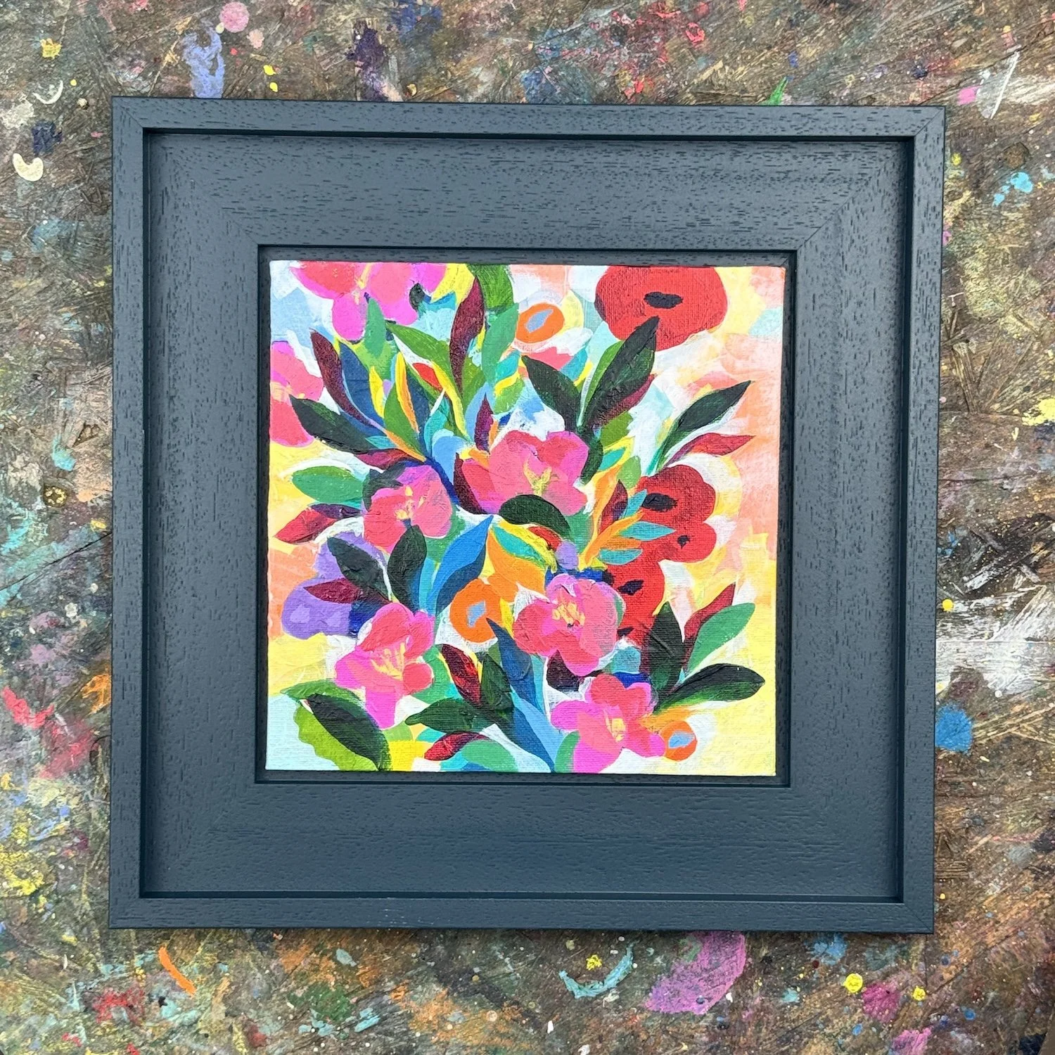 Floral artwork with gathered flowers and warm glowing tones