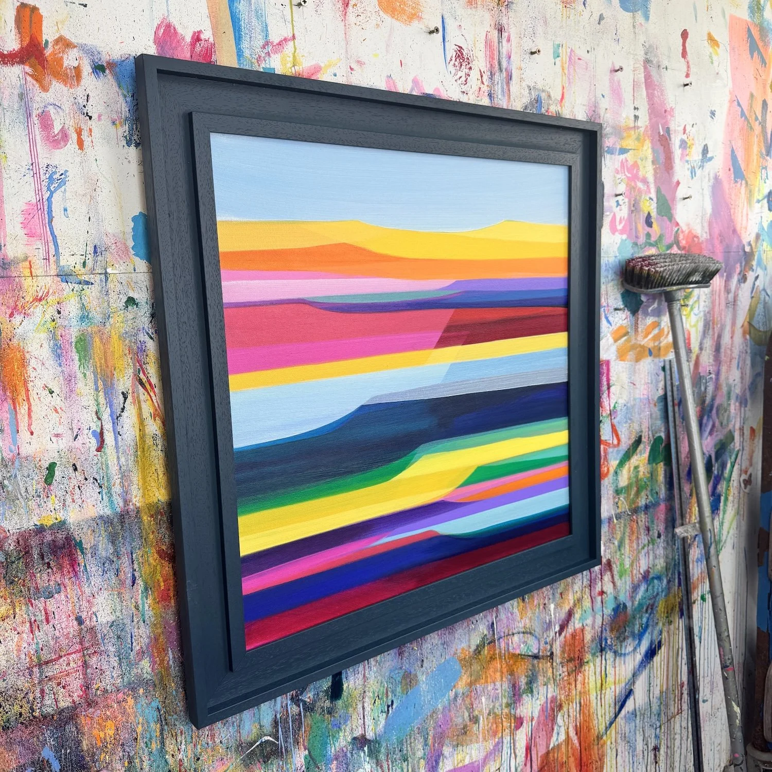 Bold landscape artwork with shifting horizons and rich colour