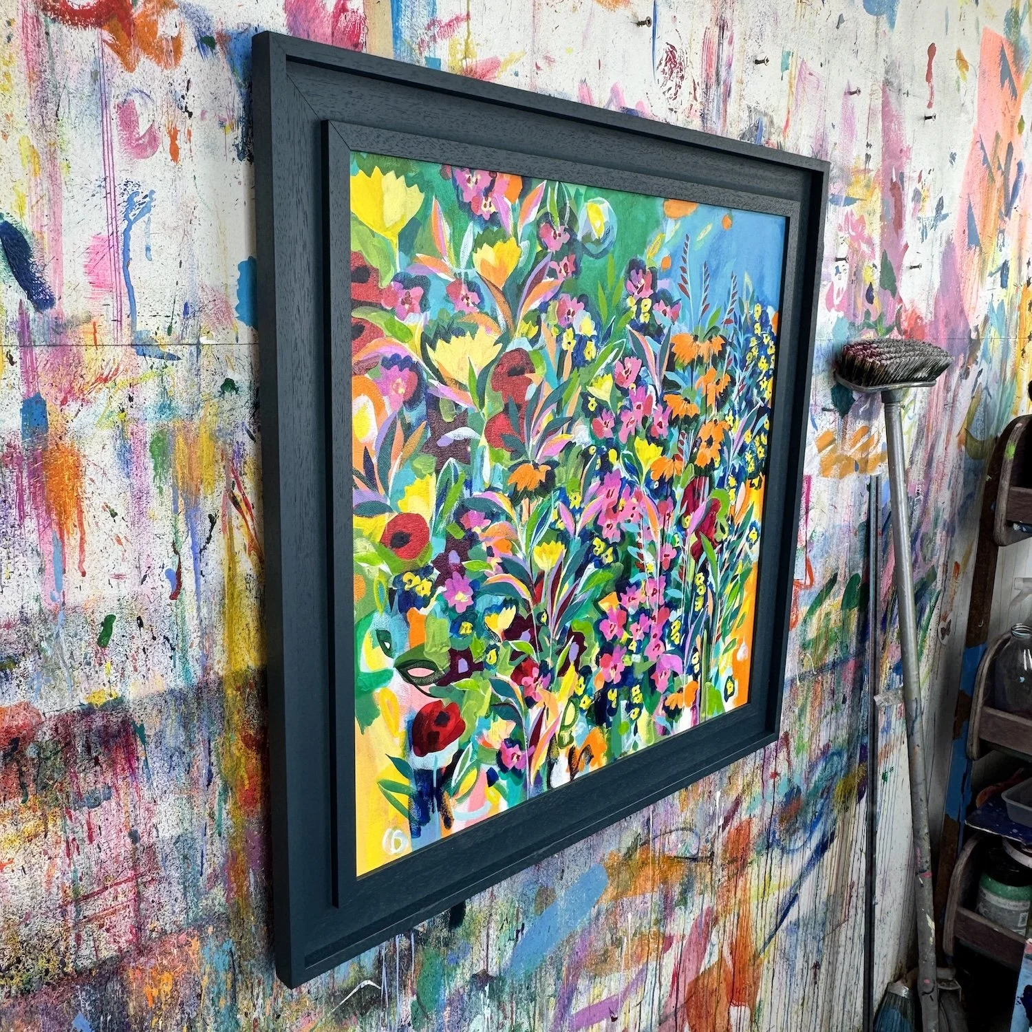 Colourful contemporary floral artwork with bright flowers and glimpses of blue sky