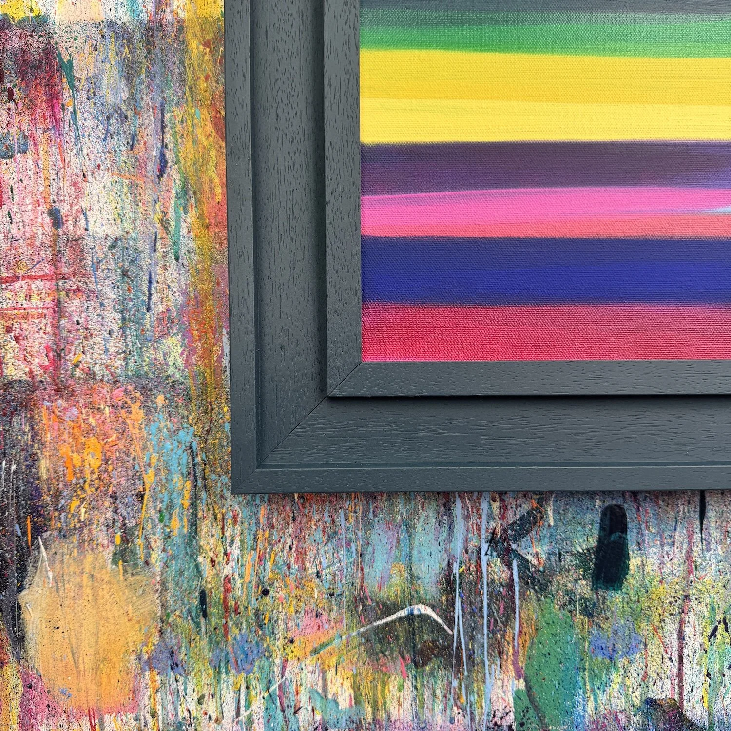 Close-up of layered paint in colourful abstract landscape