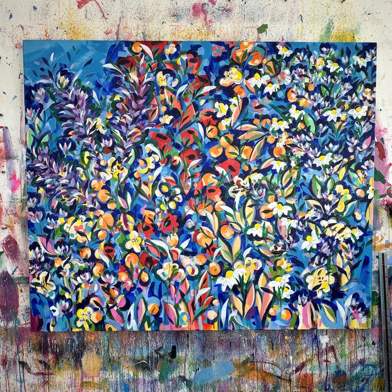 Bold floral painting with many small flowers and vibrant colour