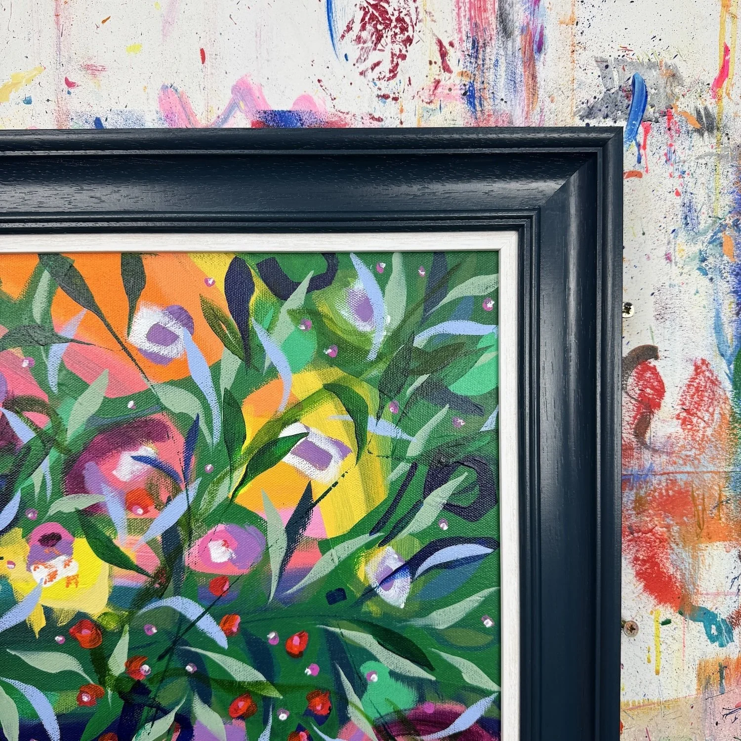 Framed floral painting with bold greens and pops of yellow in this painting titled "Forevermore" by Faye Bridgwater