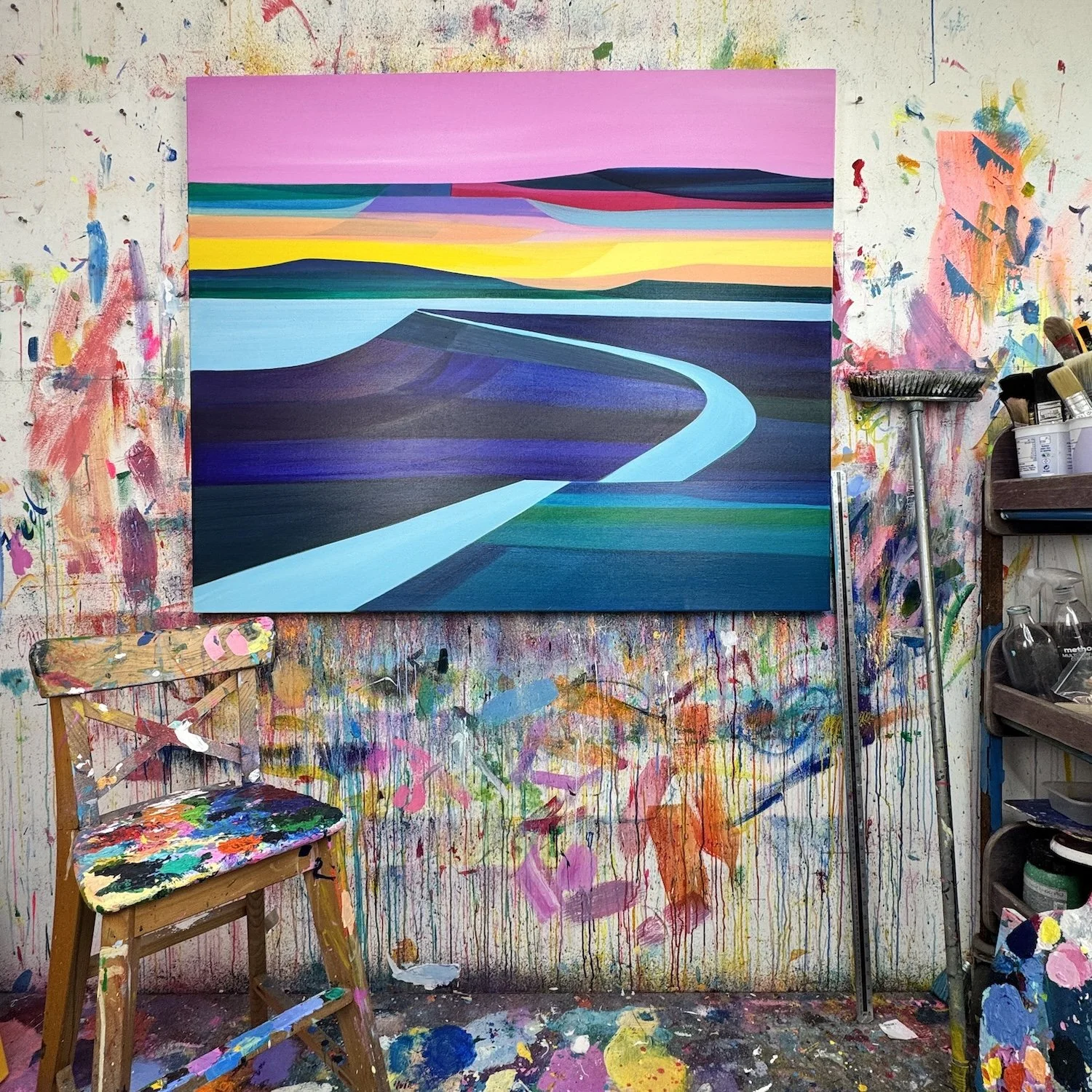 Colourful abstract landscape with pink and yellow sky and low sun