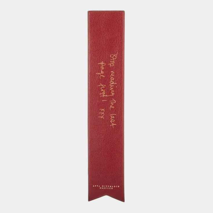 Anya Hindmarch Bespoke Bookmark $125 What could be sweeter than a handwritten message imprinted in gold foil on a leather bookmark? The perfect gift for all us bookworms!
