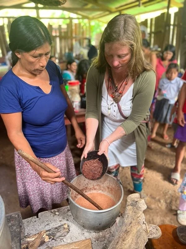 Shamanic teacher DIana Deer Hawk, ancestral ceremonial cacao preparation, with an Awajun indigenous woman, Peruvian tradition, Aynua Amazonas, Peru