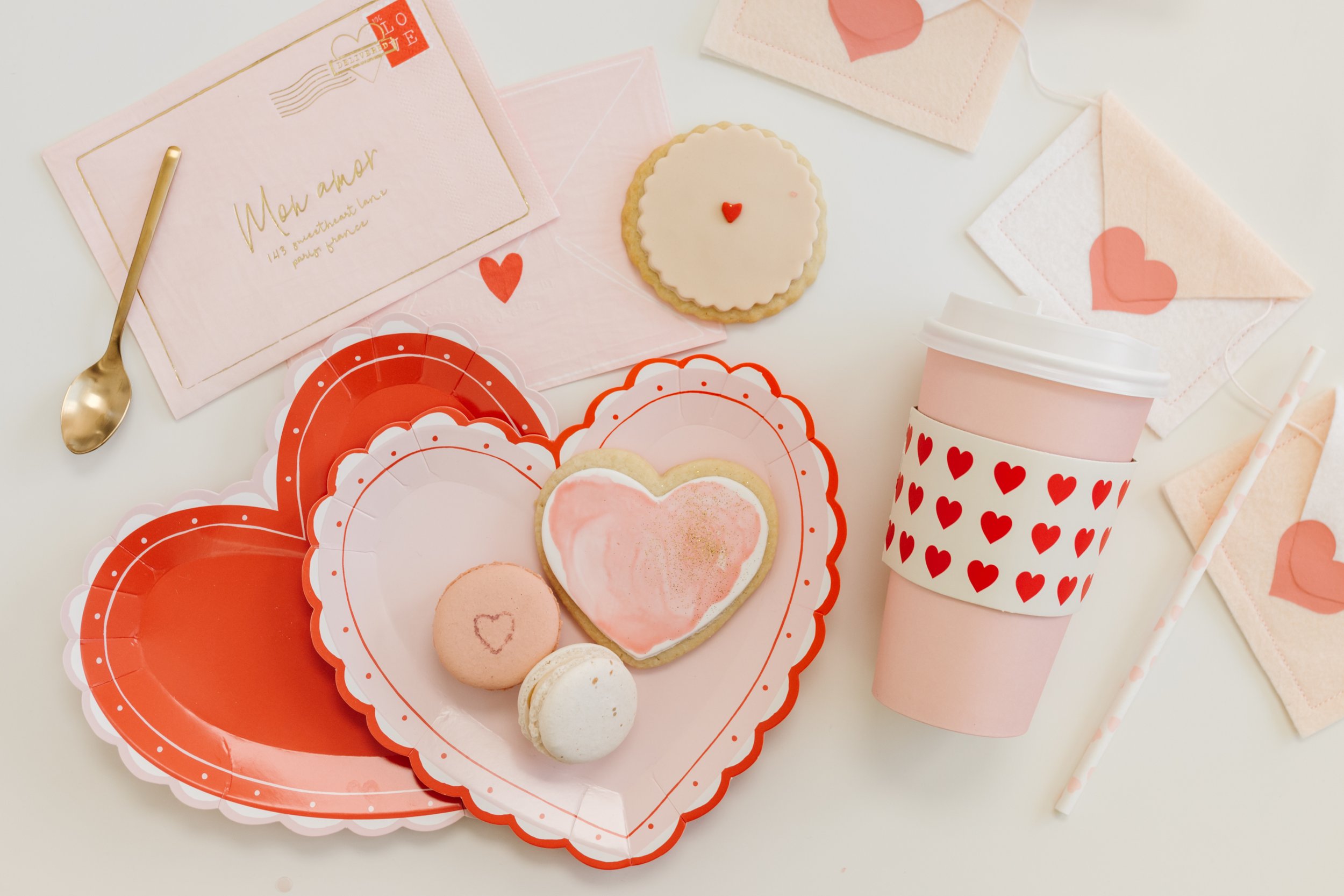   lacy heart plates   |   love note napkins   |   mini red hearts to-go cups   |   love note treat boxes   |   pink heart paper straws  