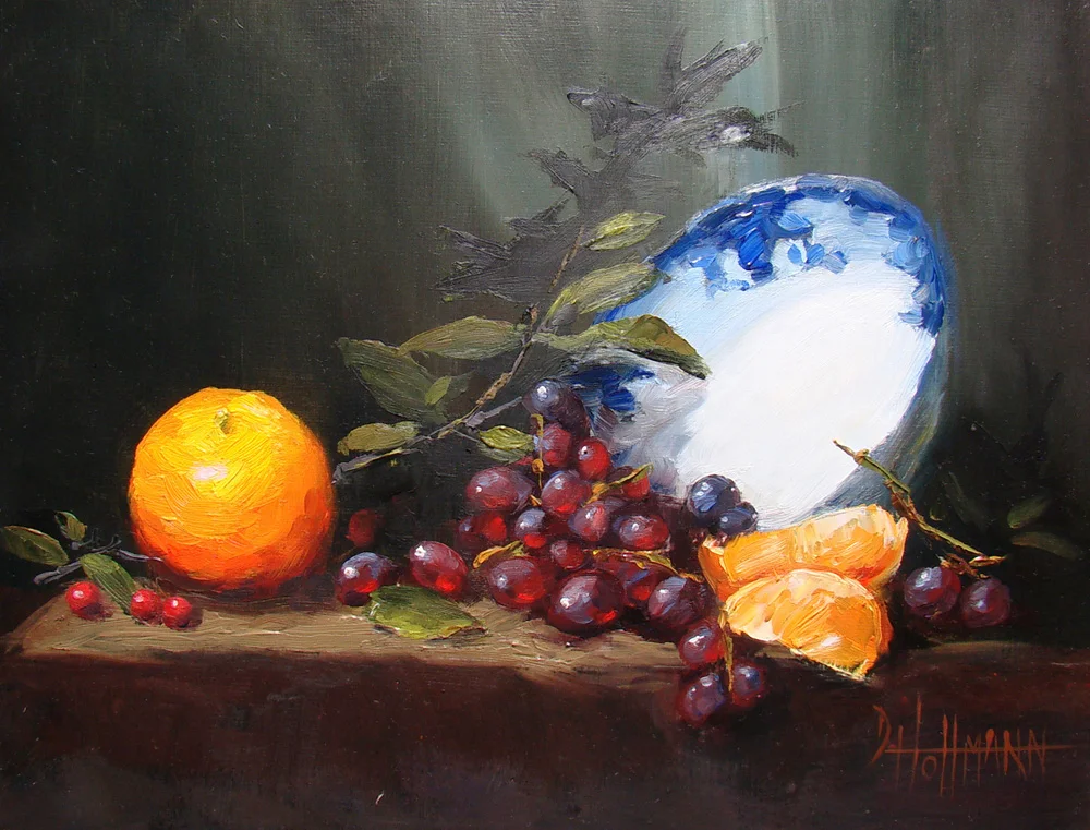 Oranges with blue and white dish