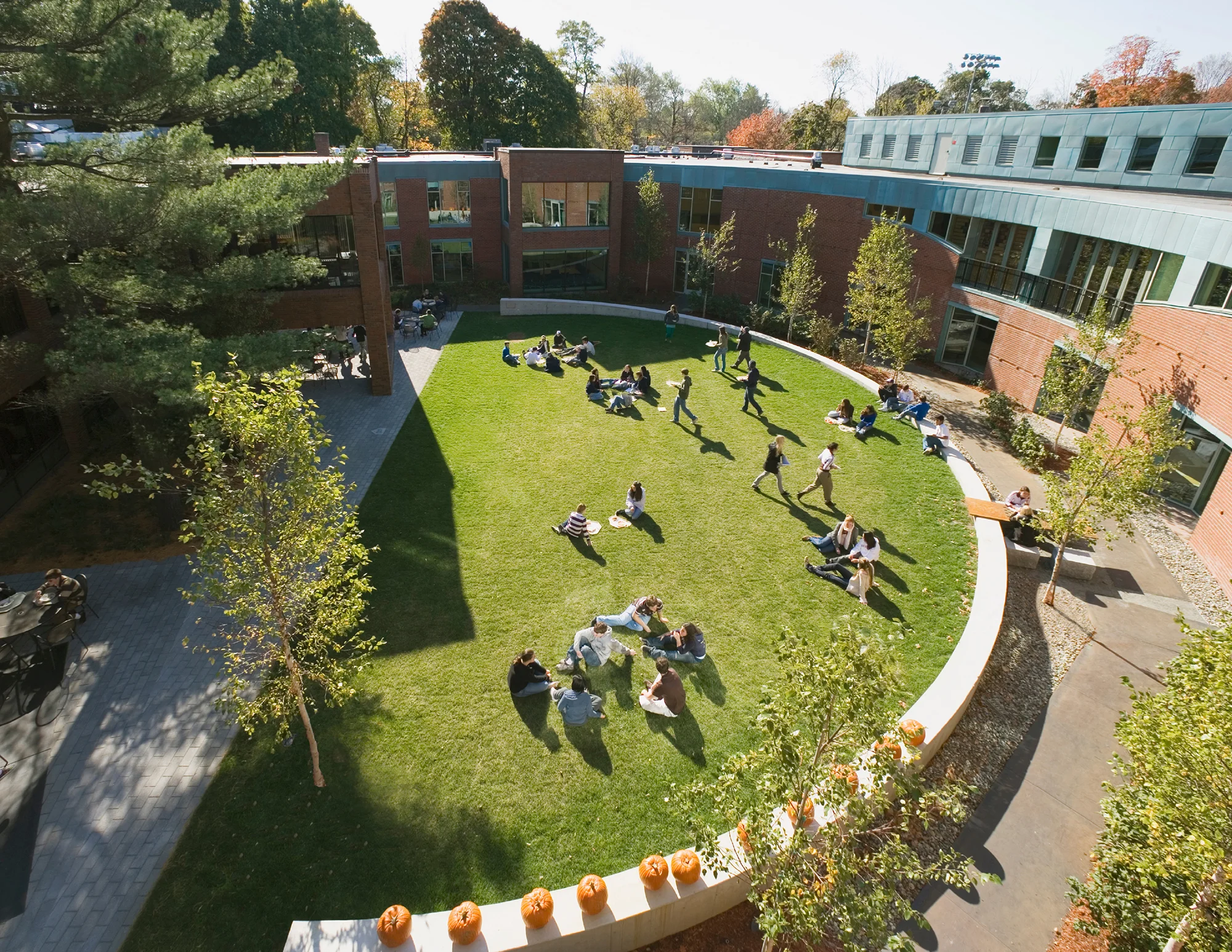 Buckingham Browne & Nichols was conceived as part of an extensive renovation and expansion of the institution’s upper school. Situated along the Charles river, the landscape builds on the diverse riparian ecosystem and is inspired by the river’s many oxbows. Repurposed steel planks and site walls flow throughout the courtyard and entry, leading students through diverse plantings of ferns, sedges, iris, holly, dogwoods, river birch and sycamores. This sequence culminates at April’s memorial garden, a space designated for the class of 1975 with a memorial cherry tree, seating and diverse mix of seasonal flowering plants. Large curving walks relate to the building’s scale and lead visitors to the renovated main entry, which brings a sense of the urban realm onto the campus. The existing large sycamores along the entry were saved to preserve the continuum of the species along the Charles River. Recognition Boston Society of Landscape Architects | Merit Award 2010 Collaborators Centerbrook Architects and Planners Photography Charles Mayer