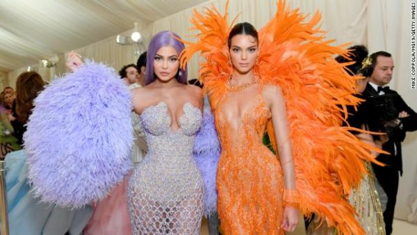 Kylie Jenner and Kendall Jenner, both wearing Versace. GETTY IMAGES