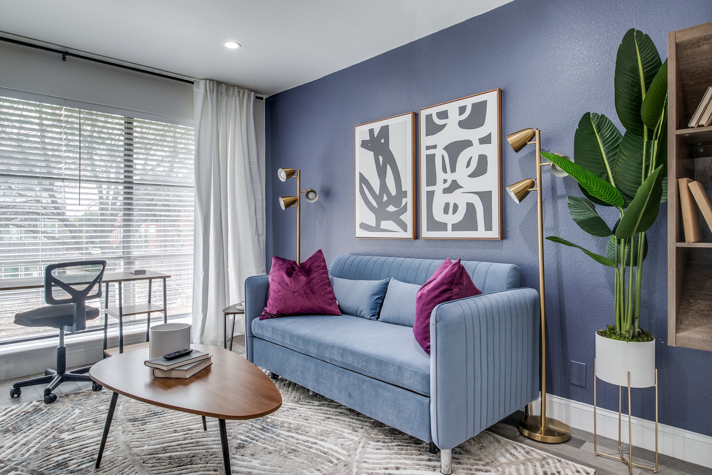 Blue couch in a clean, high end living room in a rental property in Chicago