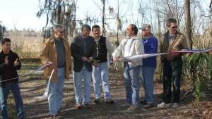 Cutting the Ribbon! Chris Bird, Alachua County Environmental Protection Director; Alachua Co. Commissioner Robert Hutchinson; Alachua Co. Commission Chair Mike Byerly; Alachua Co. Forever Program Manager Ramesh Buch; Alachua Co. Commissioner Lee Pinkoson, NRCS representative, and Interim Alachua Co. Manager Rick Drummond. Photo by Mark Sexton.
