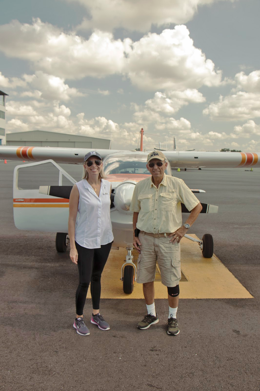 Traci Deen, Conservation Florida’s executive director standing with pilot, Charlie Martinez on flight day.