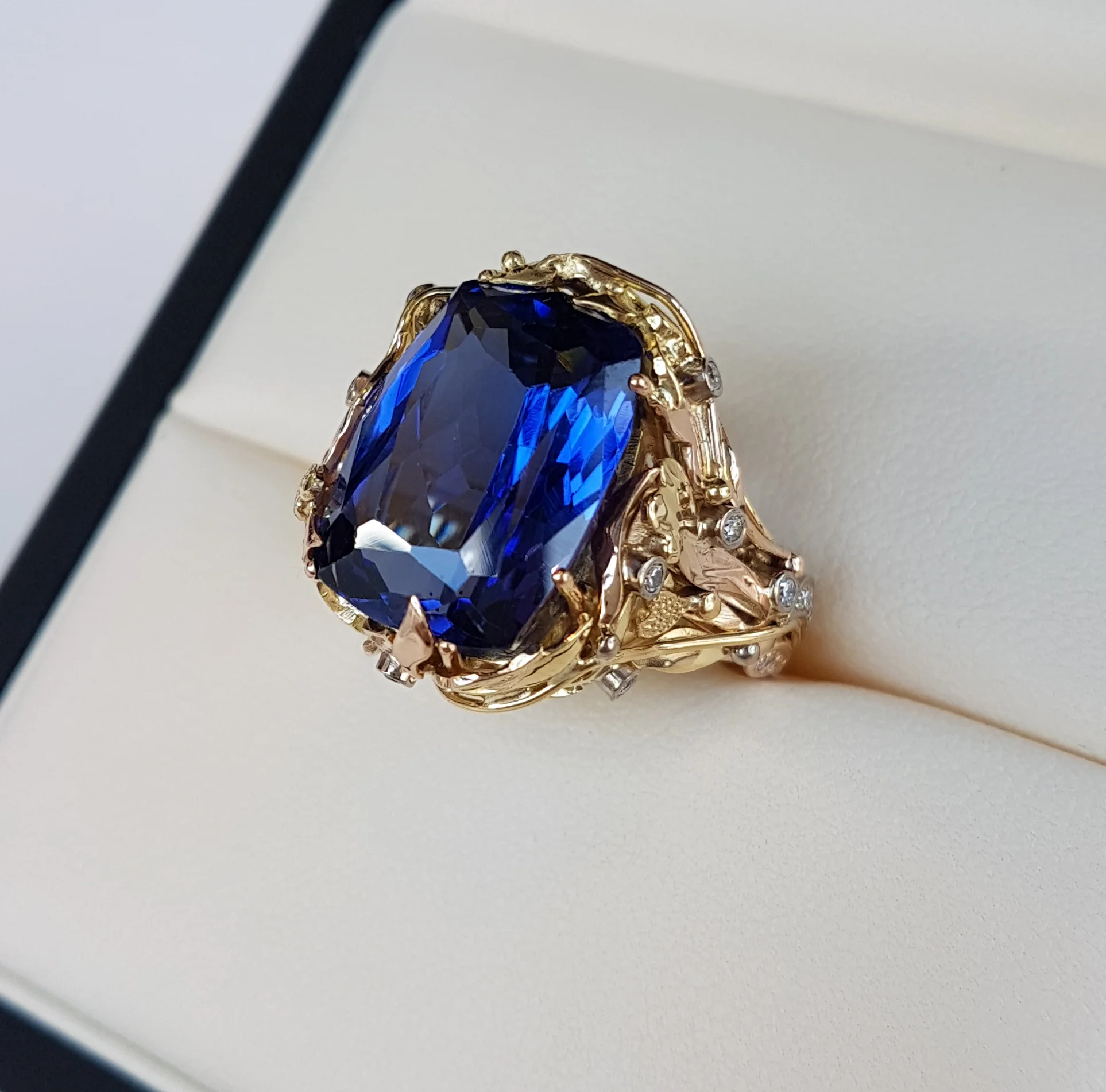 17ct of top colour Tanzanite and diamond ring in 18ct yellow and red gold made in QVJ signiture style this was a real stunner .Clients own Tanzanite