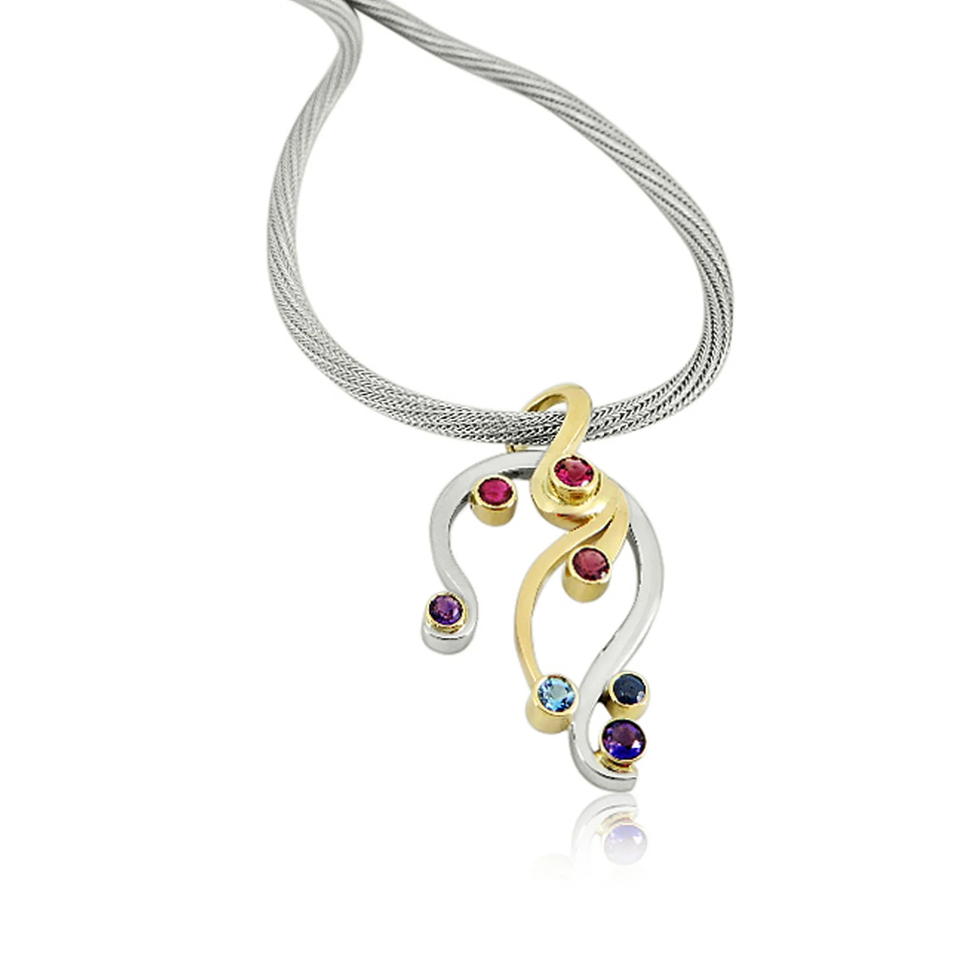 A remodel for a client who had a already remodeled pendant she didnt like we designed a flowing graceful design using her own sapphire stones and gold to go onto clients heavy chain