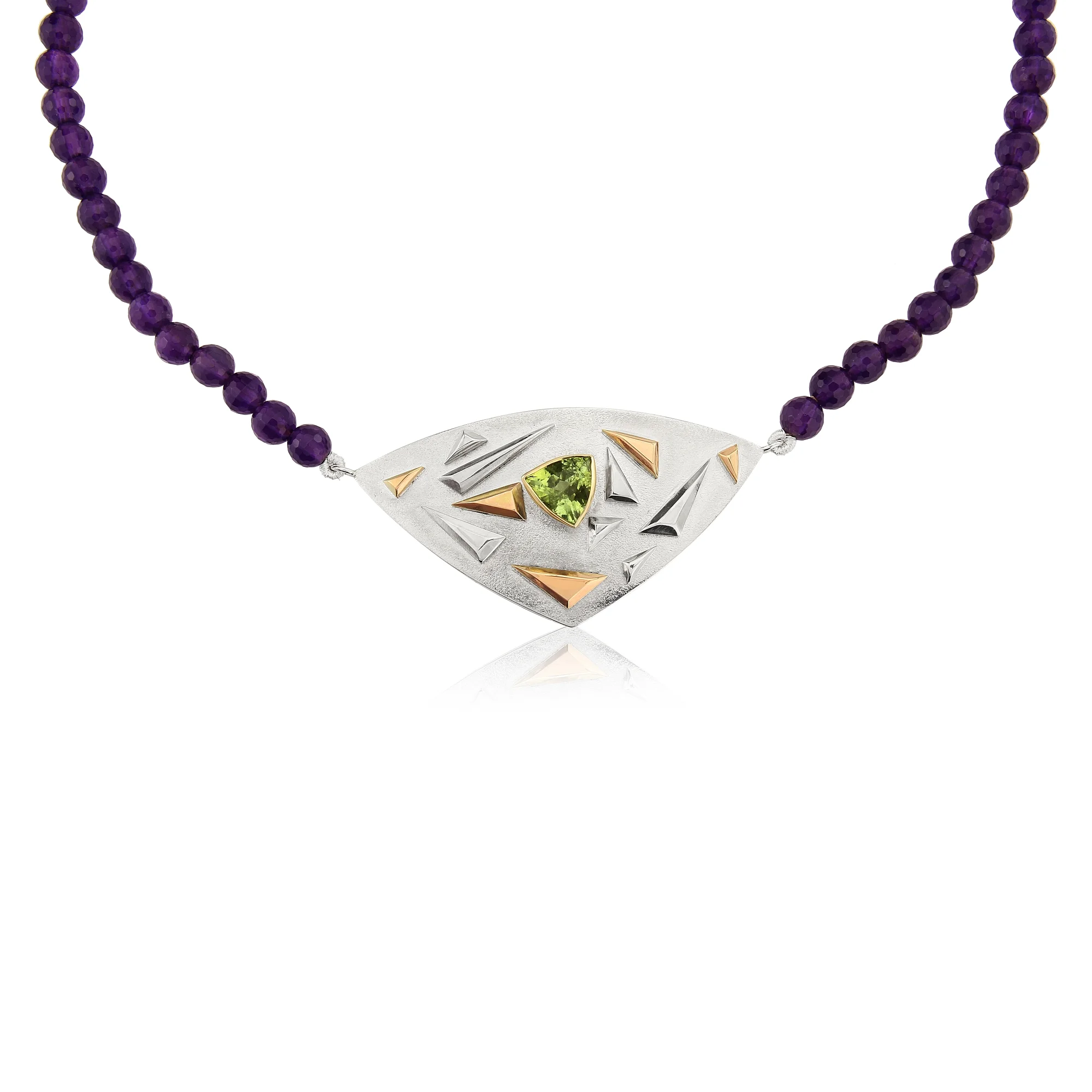 Stunning Green Tourmaline pendant mounted in silver with 9ct gold detailing and unseen in this photo, gallery work underneath designed and hand made by QVJ.