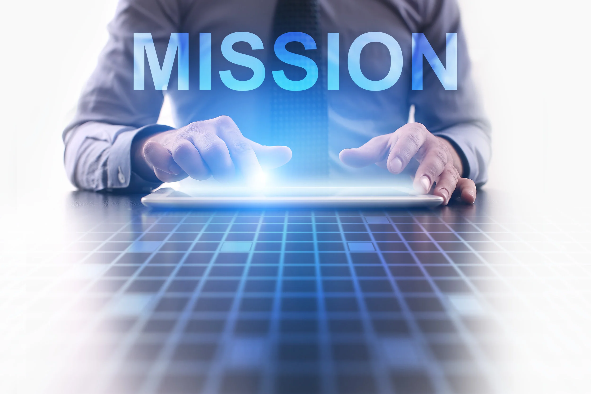 Businessman using modern tablet pc and selecting Mission.