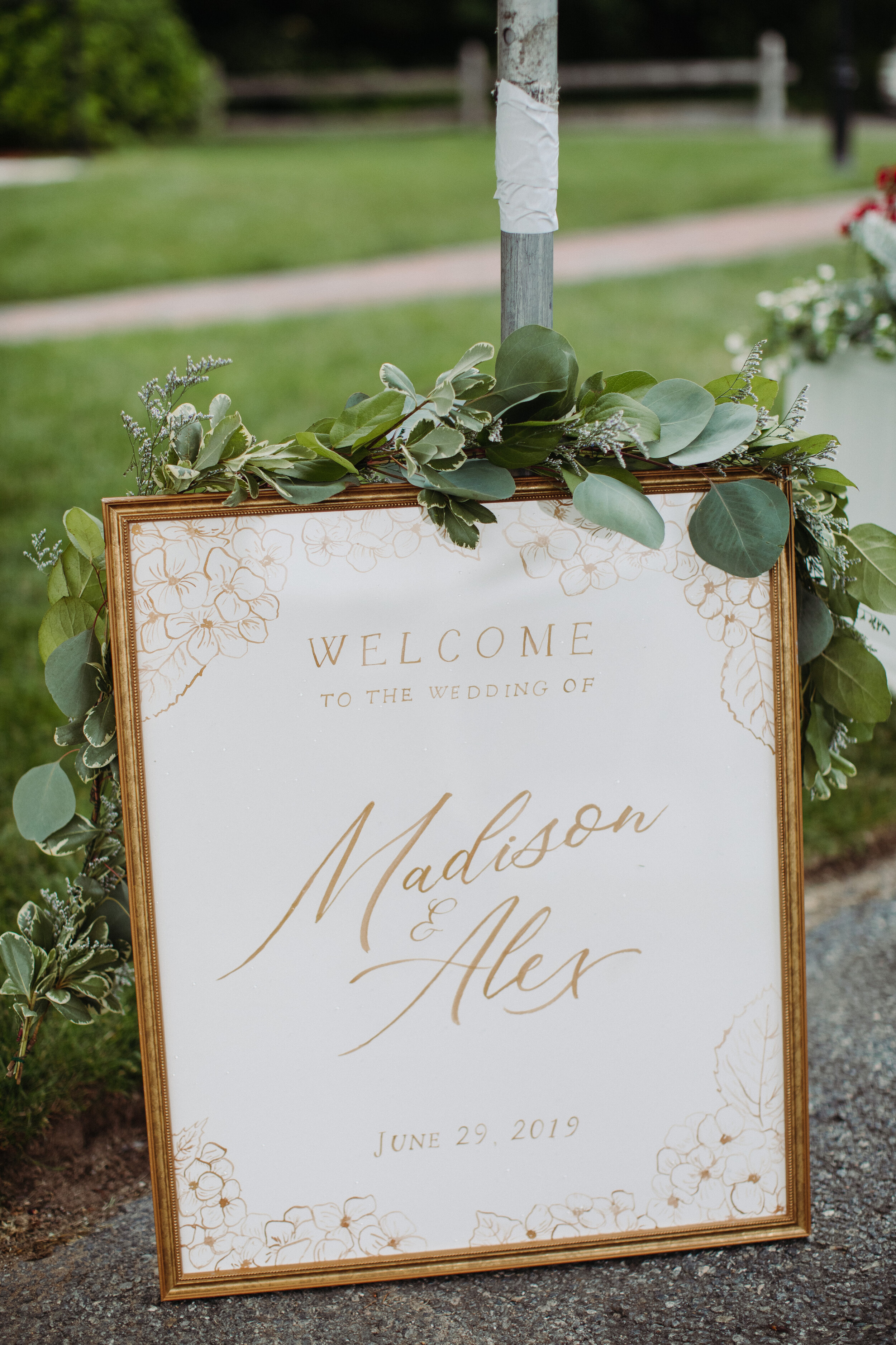 white and gold wedding welcome sign