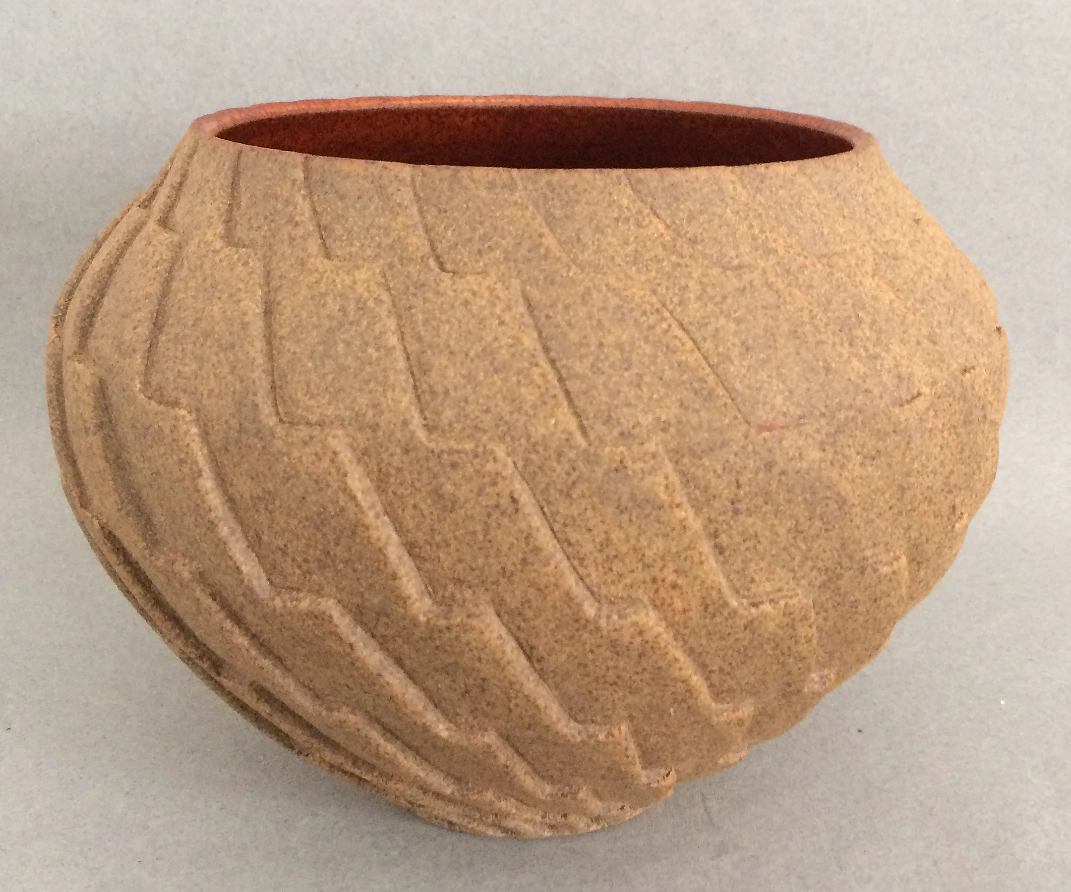 Gail Carlson carved brown vessel