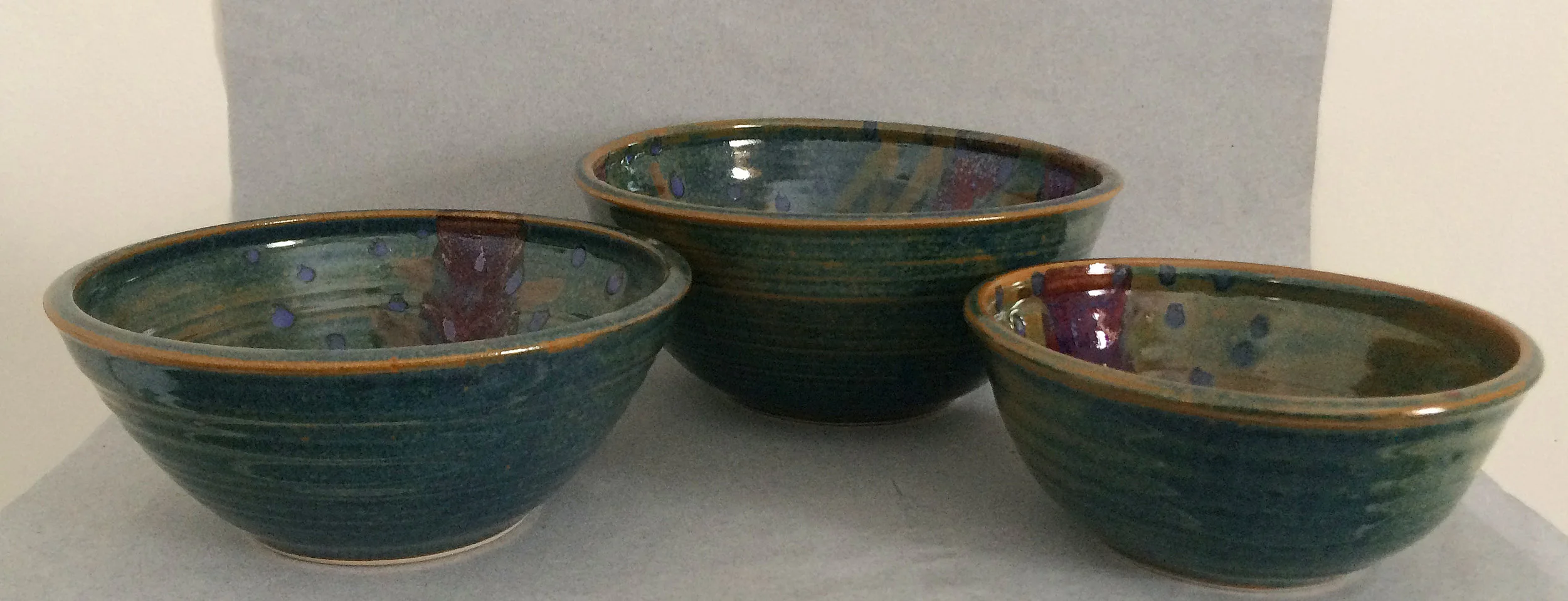 Gail Carlson large teal serving bowl (left)
