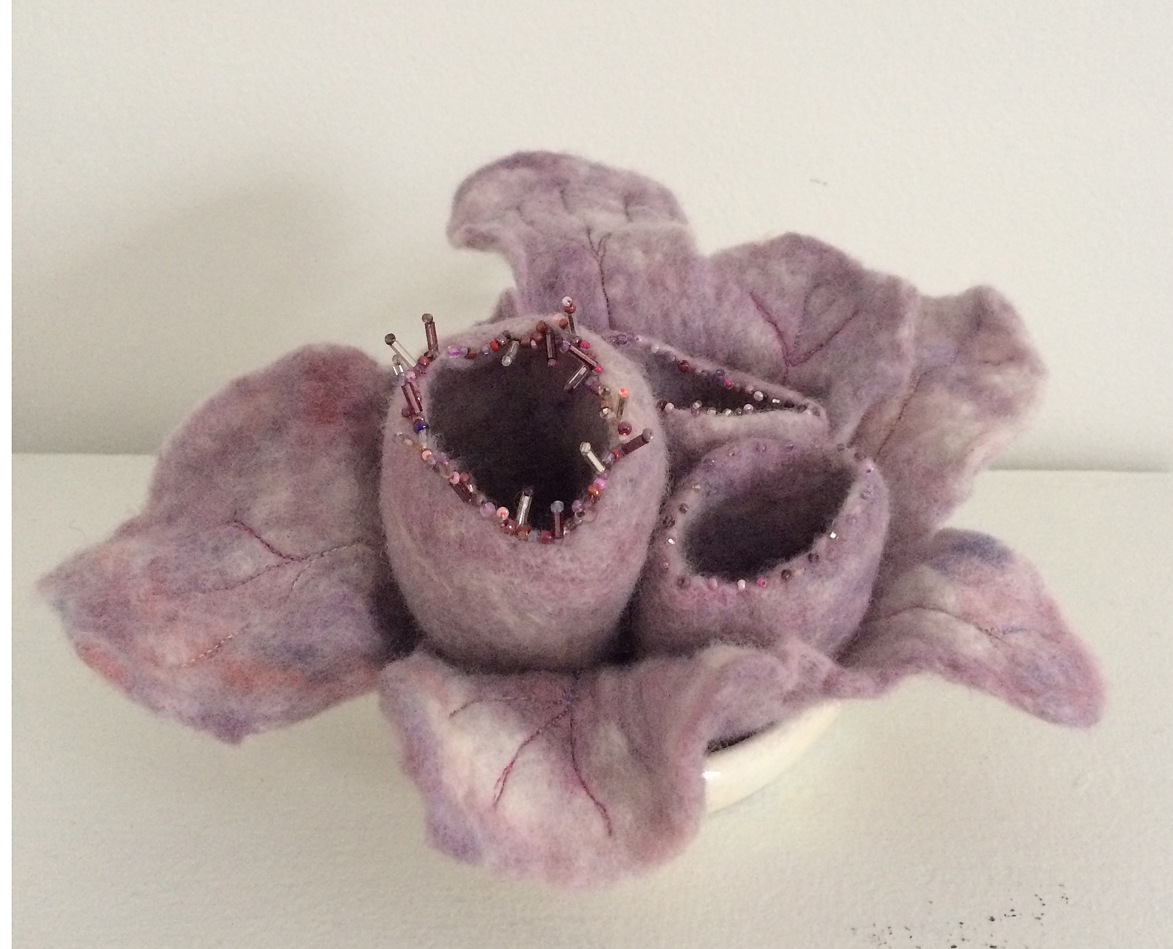 June Jacobs Bud In the Hand decorative vessel