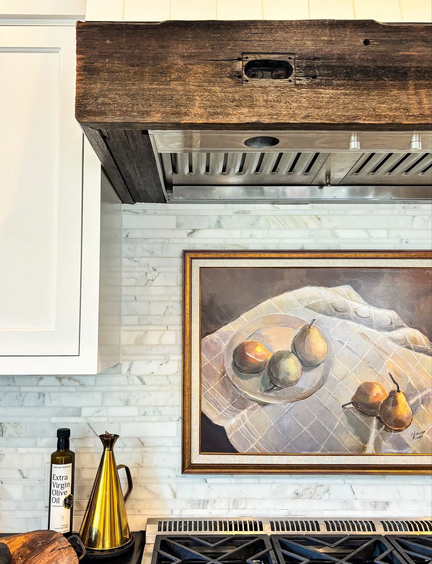 gave my kitchen a little upgrade last month &mdash; just a touch of Italian flair 🇮🇹 &mdash; with a piece of art above my stove. It gives me something more interesting to look at while I cook and a bit of visual joy from my desk, which faces right 