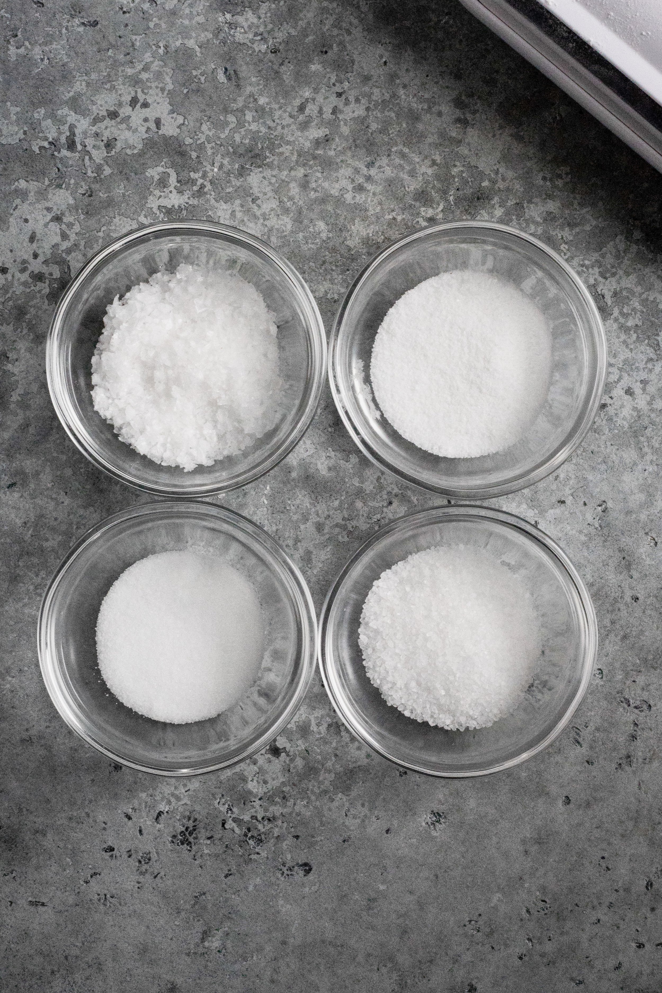  Fleur de sel (top left), fine sea salt (top right), table salt (bottom left), kosher sea salt (bottom right) 