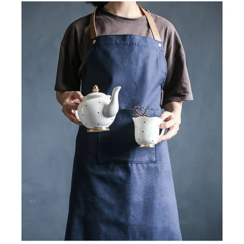    Wonder HOME Danish Apron    One size fits most! This blue apron will look good on anyone. And like good food, its attention to detail belongs to the real cowhide shoulder strap. The cowhide strap iis 10 times more expensive than synthetic leather and its application in the Wonder apron is subtle and design-savvy. Perfect for wannabe chefs. 