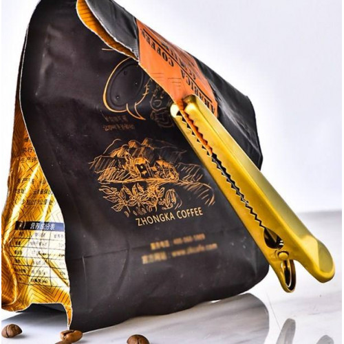    Golden Clip, large    Forget tying rubber bands around opened packs of oats, cereal, or coffee. A nice golden clip is the best, and most visually-pleasing solution. 