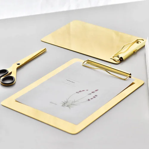    Writing pad, gold, large    A golden writing pad will entice you to always write something. Doodles are also encouraged. 