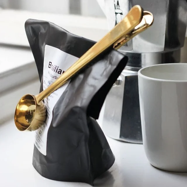    Nordic Gold coffee clip/spoon    This Wonderful Home Nordic golden clip with spoon is just that, wonderful. Open your coffee bag, scoop, then clip it again. Easy, no? 