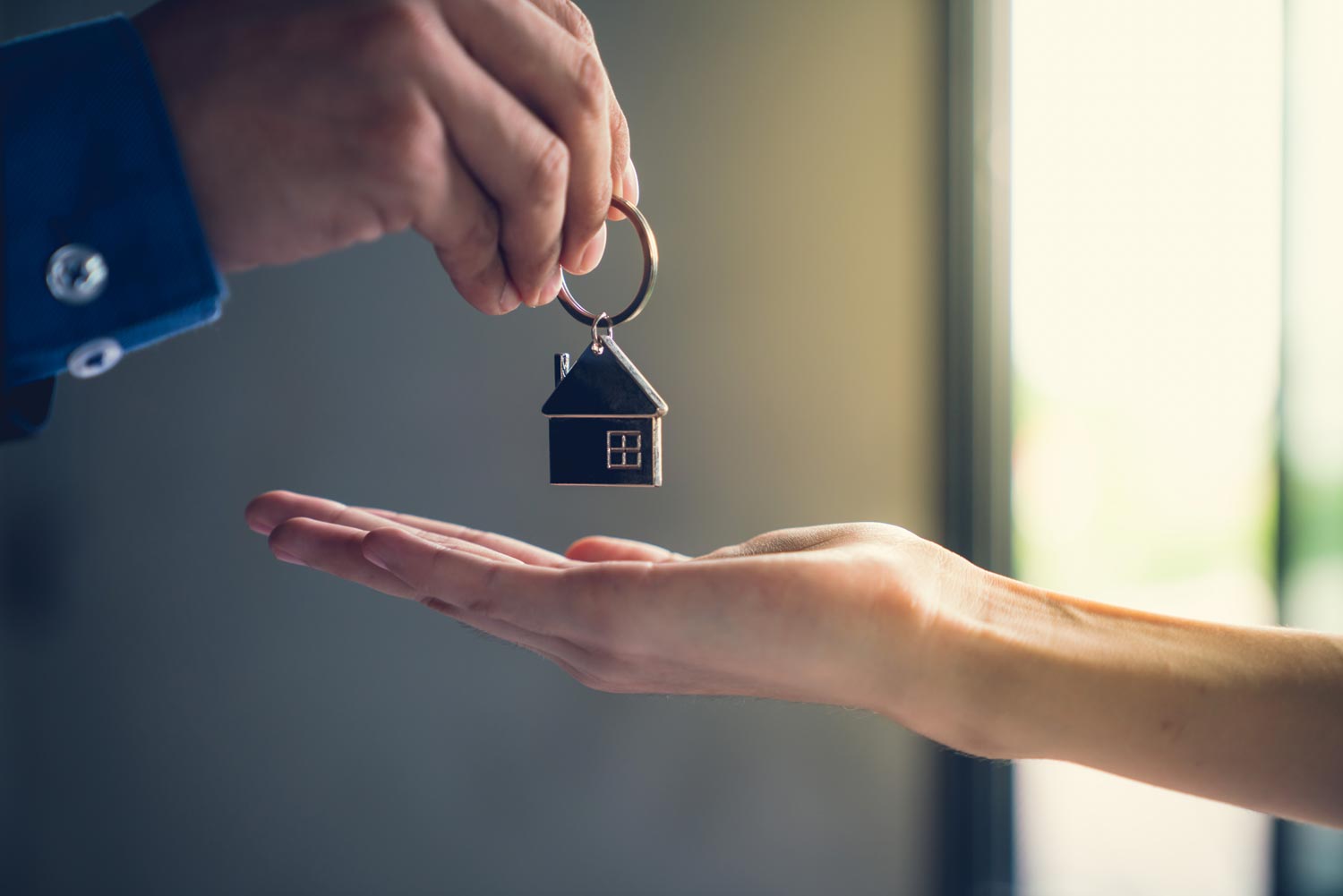 Man-handing-woman-keys.jpg