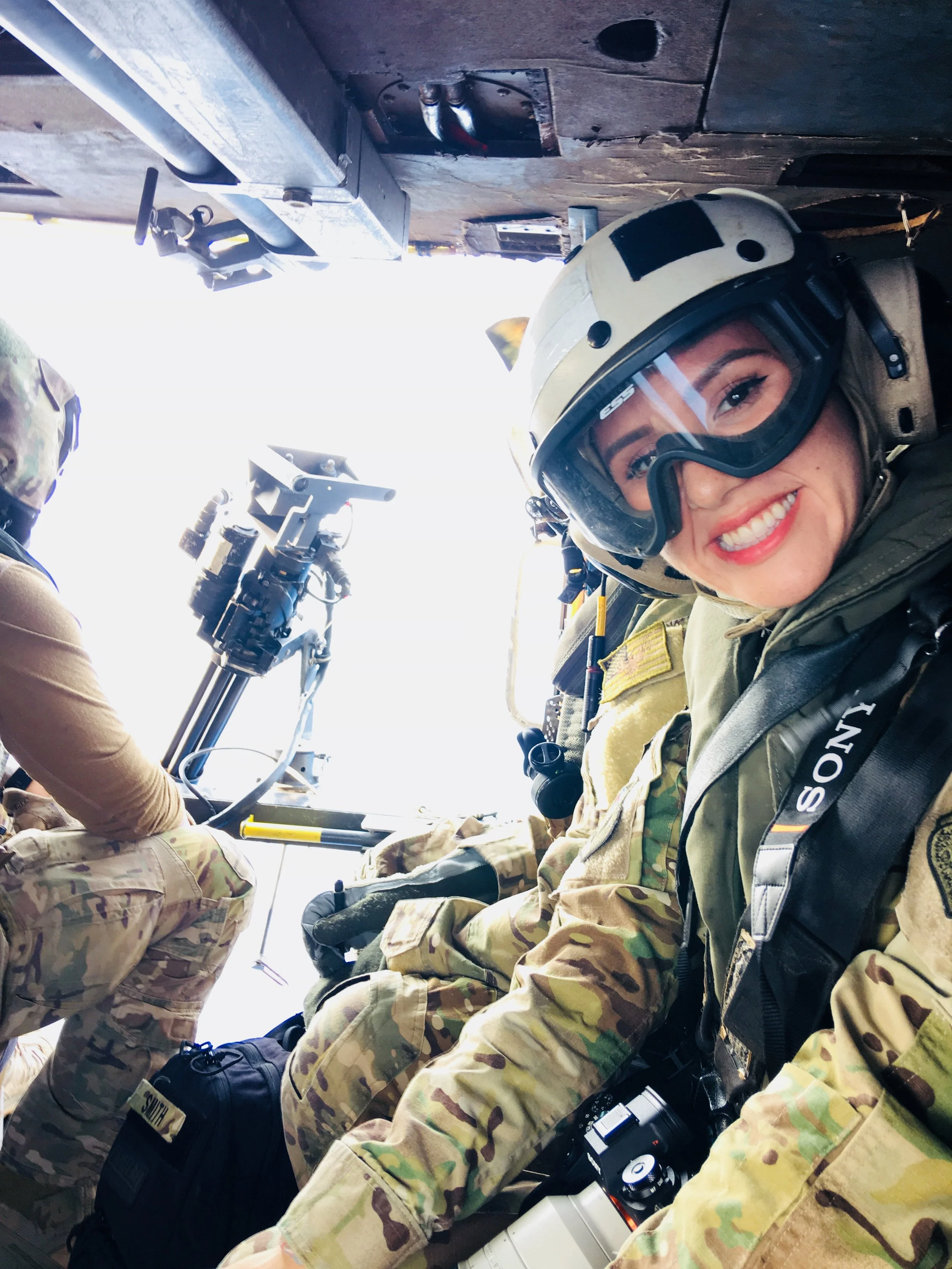 Jessica Tait wears flight gear aboard a U.S. military aircraft.