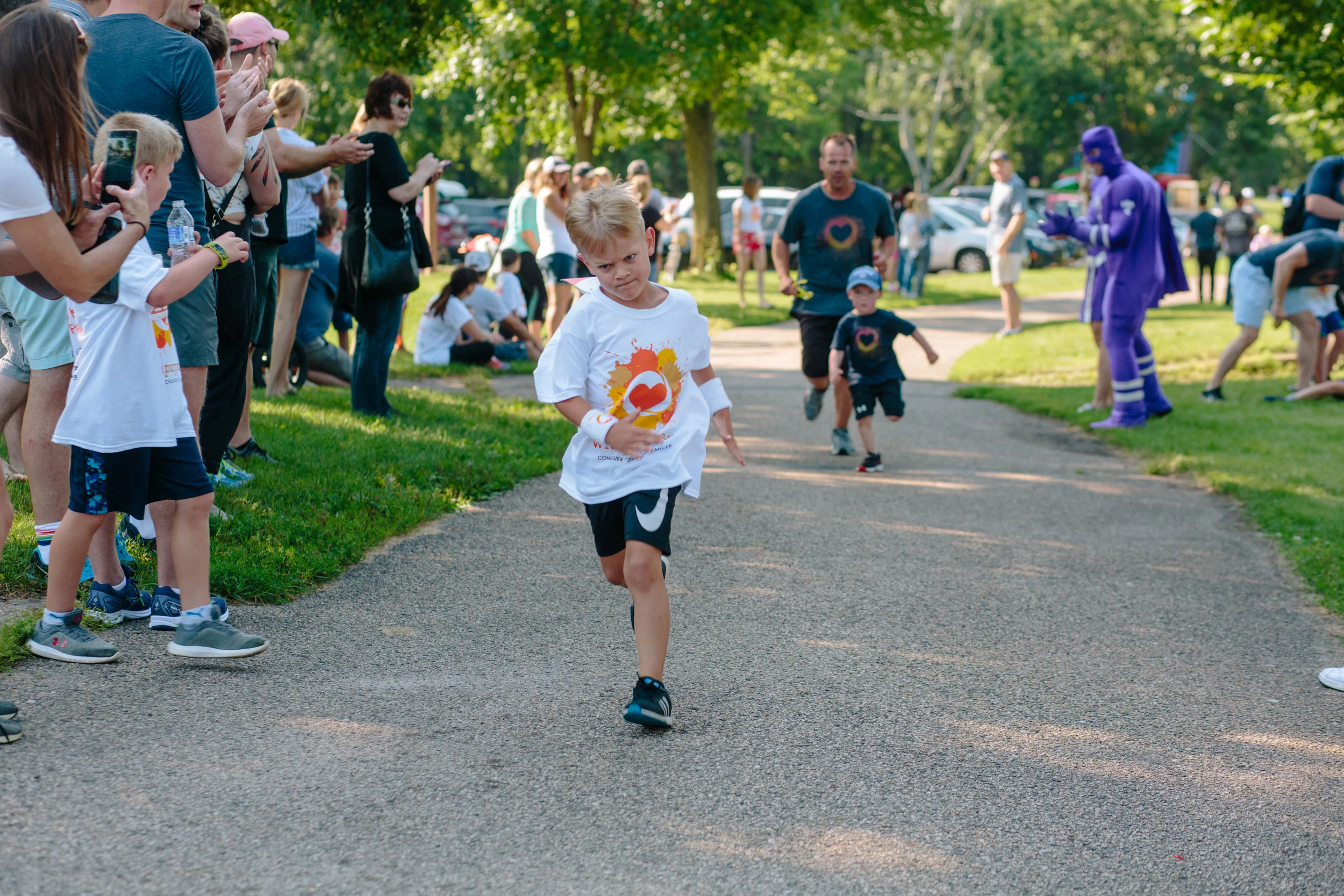 Max, determined and fierce, finishes a one mile run at the 2018 Fight for 5K and Fun Run.