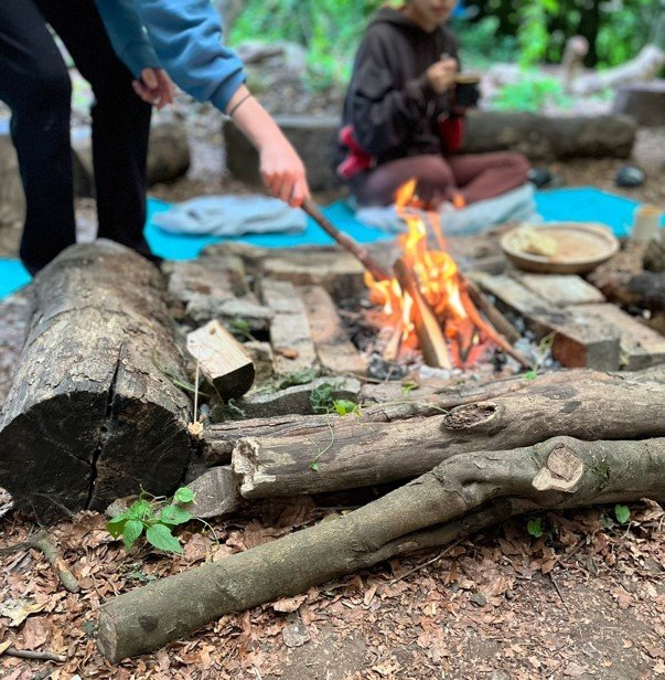 girls around the fire.jpg