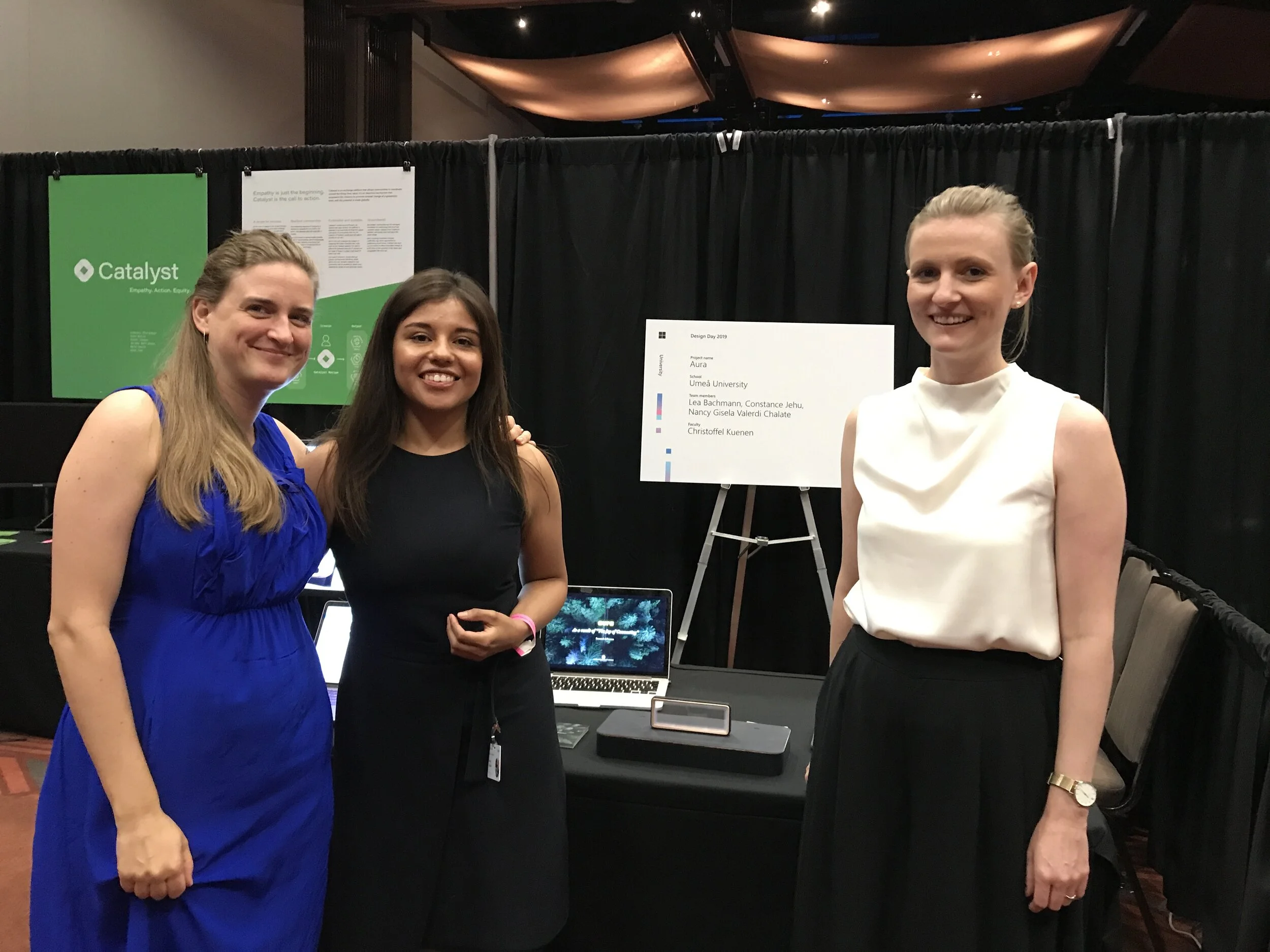 The part of the team that had the opportunity to join the Microsoft Design Expo. Left to Right: Connie Jehu, Nancy Valerdi and me (Lea Bachmann) in front of our stand at the Expo.