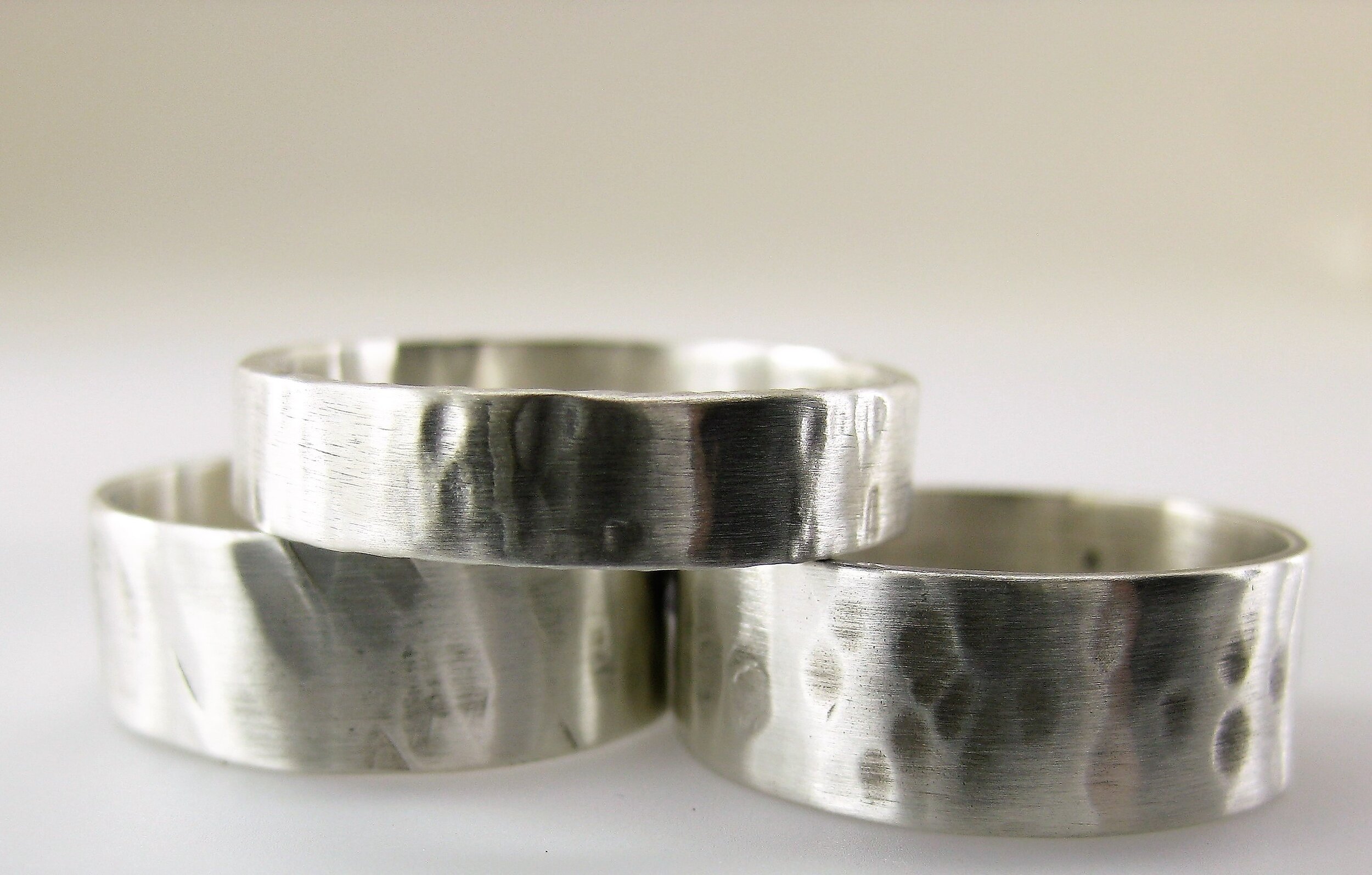 A wide selection of narrow and wide silver rings for men