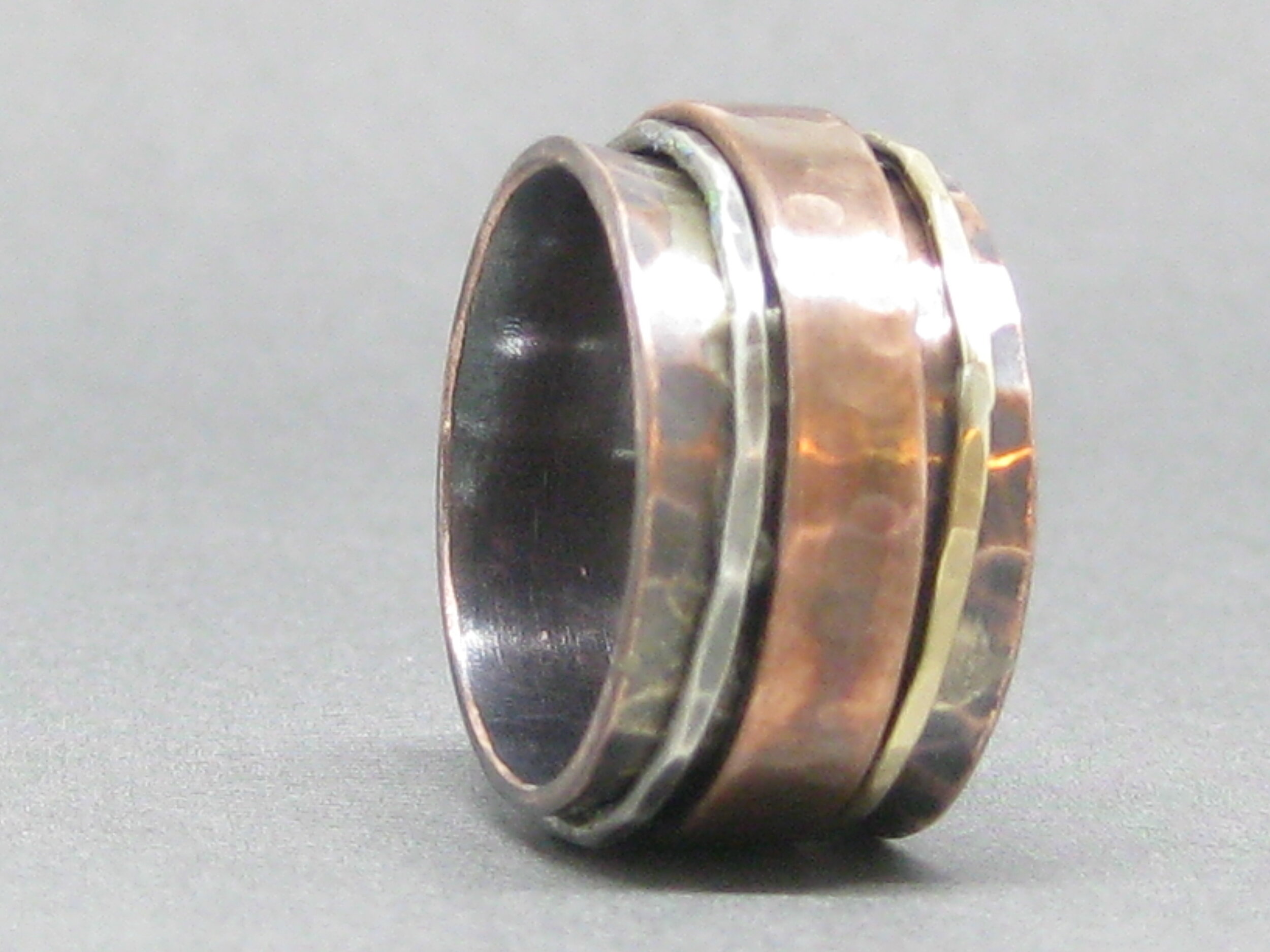 Mixed metal spinner ring ~ hammered