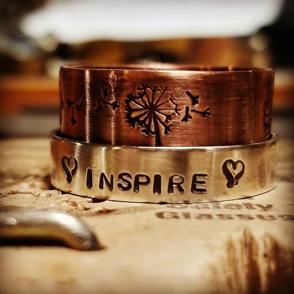 Mixed metal hand stamped with "Inspire" spinner ring