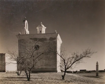 old mission with belltower in arid climate