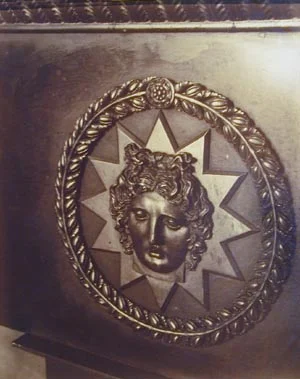 Ornatearchitectural circular relief of Apollo in front of star