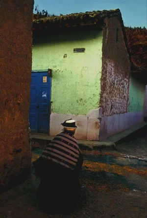 person walking in colorful peruvian alley