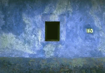 blue washed paint wall black window