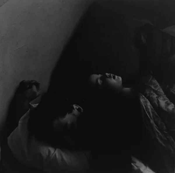 woman and girl in bed family scene